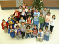 Thumbnail image of item number 1 in: '[Students and their teacher pose with the books at Seminary Hills Elementary]'.