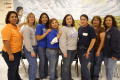 Primary view of [Staff of the Chavez School pose in front of a mural honoring Cesar Chavez]