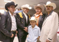 Photograph: [Four men and a boy wearing cowboy hats]