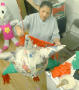 Thumbnail image of item number 1 in: '[Woman decorates a piñata]'.