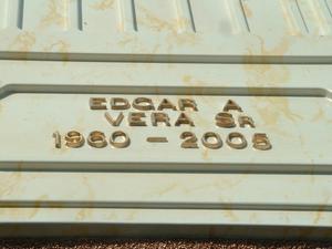 [Close-up of name and date on Edgar Vera's casket]