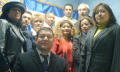 Primary view of [Salvadorian Committee of Dallas-Fort Worth standing in front of banner]