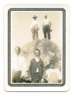 [Photograph of a Group by a Rock]