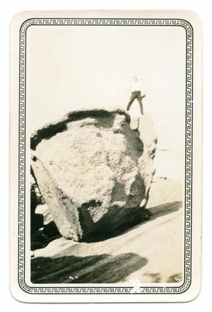 [Photograph of a Man Standing on Balanced Rock]
