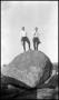 [Photograph of Two Men Standing on Balanced Rock]
