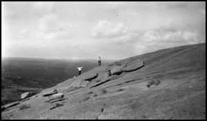 [Photograph of Two Men Standing on Enchanted Rock]