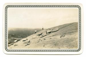 [Photograph of Two Men Standing on Enchanted Rock]
