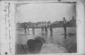 [Photograph of Men and Boys on Floating Wooden Sidewalk]
