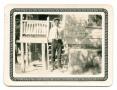 Photograph: [Photograph of  Young Man Standing on the Steps of a Porch]