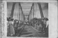 Primary view of [Photograph of Flood victims on Railroad bridge]