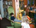 Photograph: [Several unidentified children in Emily Fowler Library]