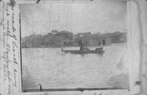 [Photograph of Men in Rowboat in Downtown Richmond]