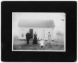 Photograph: [Unidentified house and four inhabitants]