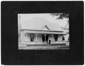 Primary view of object titled '[Unidentified woman on porch of house]'.