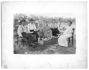Primary view of object titled '[Several unidentified people eating watermelon]'.