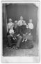 Photograph: [Two adults and five children posing in American Victorian attire]