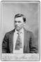 Photograph: [Young man wearing suit jacket and necktie]