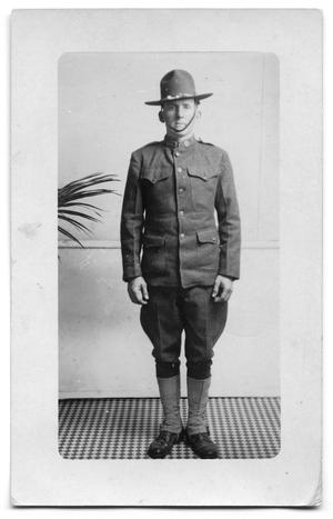 [World War I Army soldier posing in uniform]