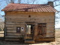 Thumbnail image of item number 1 in: '[Photograph of Davis-Ansley Log Cabin Home]'.
