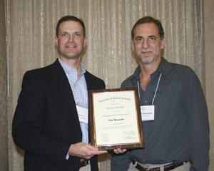 [Kirk Winemiller accepts award at the 2012 annual meeting banquet]