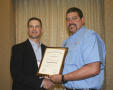 Photograph: [David Glezman accepts award at the 2012 annual meeting banquet]