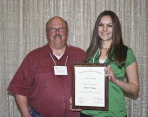 [Larissa Kitchens accepts award at the 2012 annual meeting banquet]