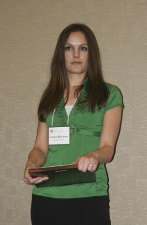 [Larissa Kitchens with award at the 2012 annual meeting banquet]