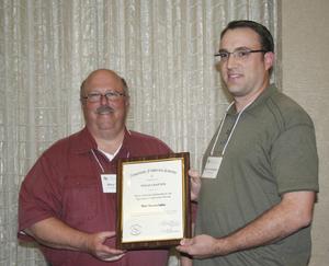 [Matt VanLandeghem accepts scholarship award at the 2012 annual meeting banquet]