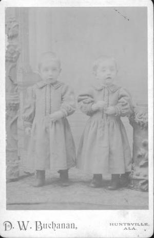 Primary view of object titled '[Two young children in matching outfits]'.