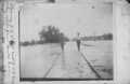 Thumbnail image of item number 1 in: '[Photograph of Men Walking on Flooded Railroad Track]'.