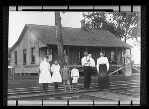 [Unidentified Family standing in front of a Anderson County House]