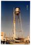 Photograph: [Dismantling old water tower, full shot]
