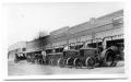 Photograph: [Tractors in front of O.M. Gentle Hardware store]