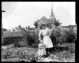 Photograph: [Woman and Child in Garden]