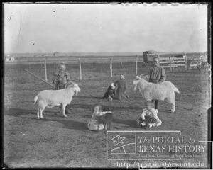 [Children with two goats]