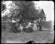 Photograph: ["Tea party" in the yard]