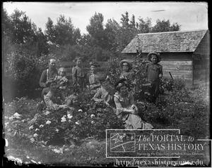 Primary view of object titled '[Family group in flower garden #2]'.