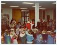 Primary view of [Santa Claus at Helen Hall Library]