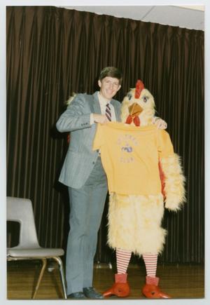 [Man with a Chicken Mascot]