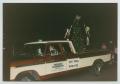 Photograph: [Pick-Up Truck in a Holiday Parade]