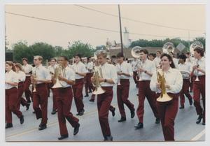 Primary view of object titled '[High School Marching Band in a Parade]'.