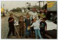 Photograph: [People Standing on Train Tracks]