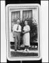 Photograph: [A Man and Woman Standing Outside]