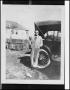 Photograph: [Man Leaning Against an Automobile]