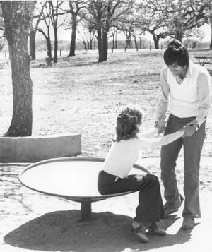Primary view of object titled 'Young Couple on Playground at Chisholm Park'.