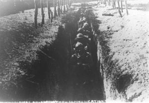 French Soldiers Advancing Through Trenches During WWI
