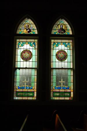 St. John the Baptist Catholic Church, detail of arched stained glass windows