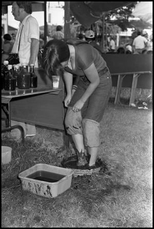 [Visitor Trying Out Grape Stomping]