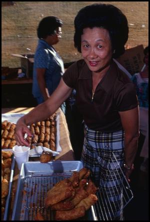 Primary view of object titled '[Gladys Wong in the Chinese Food Booth]'.