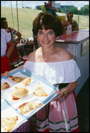 [Woman Holding a Tray of Pizza Slices]
